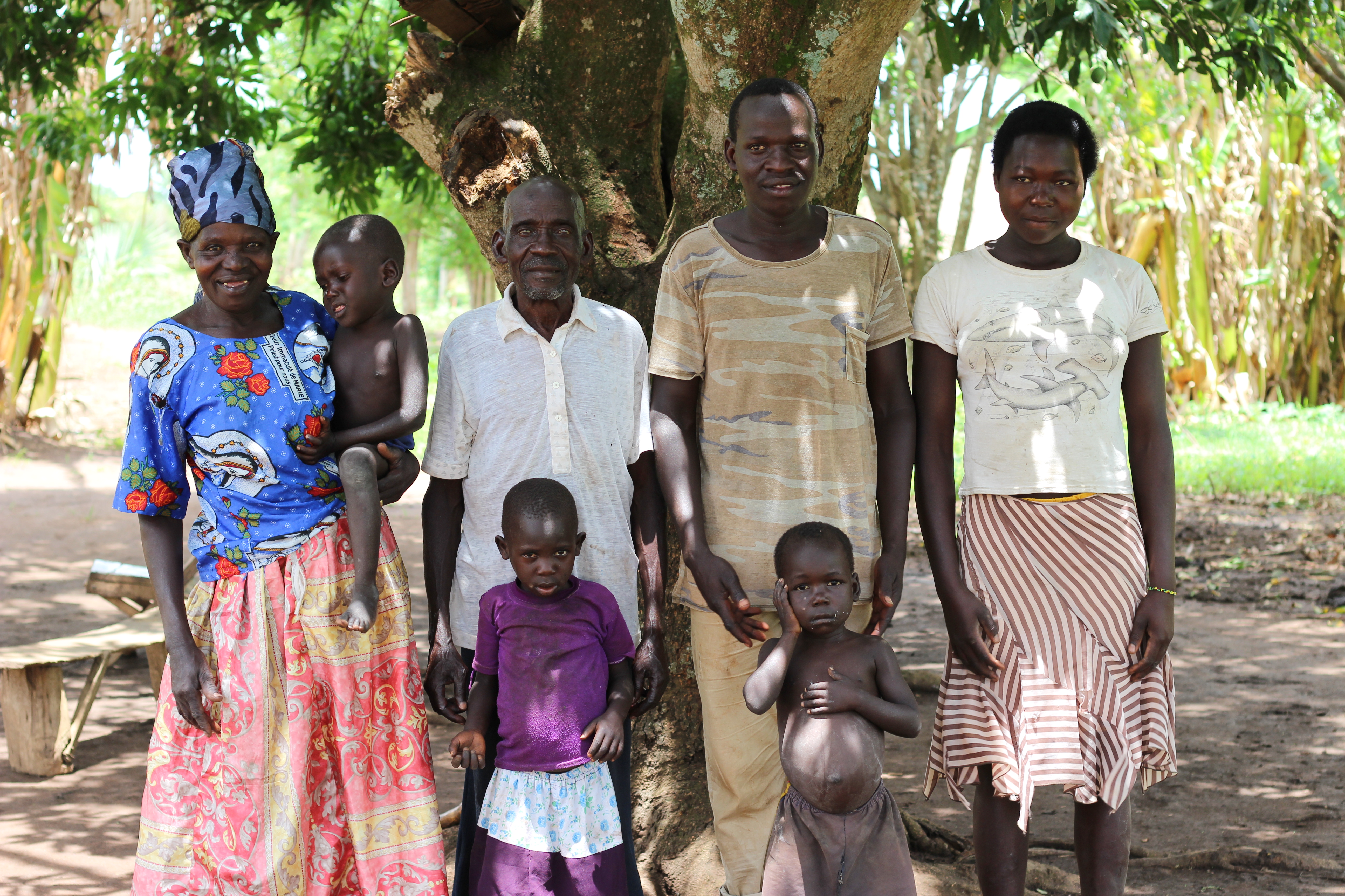 Ajok with her family pose for a photo