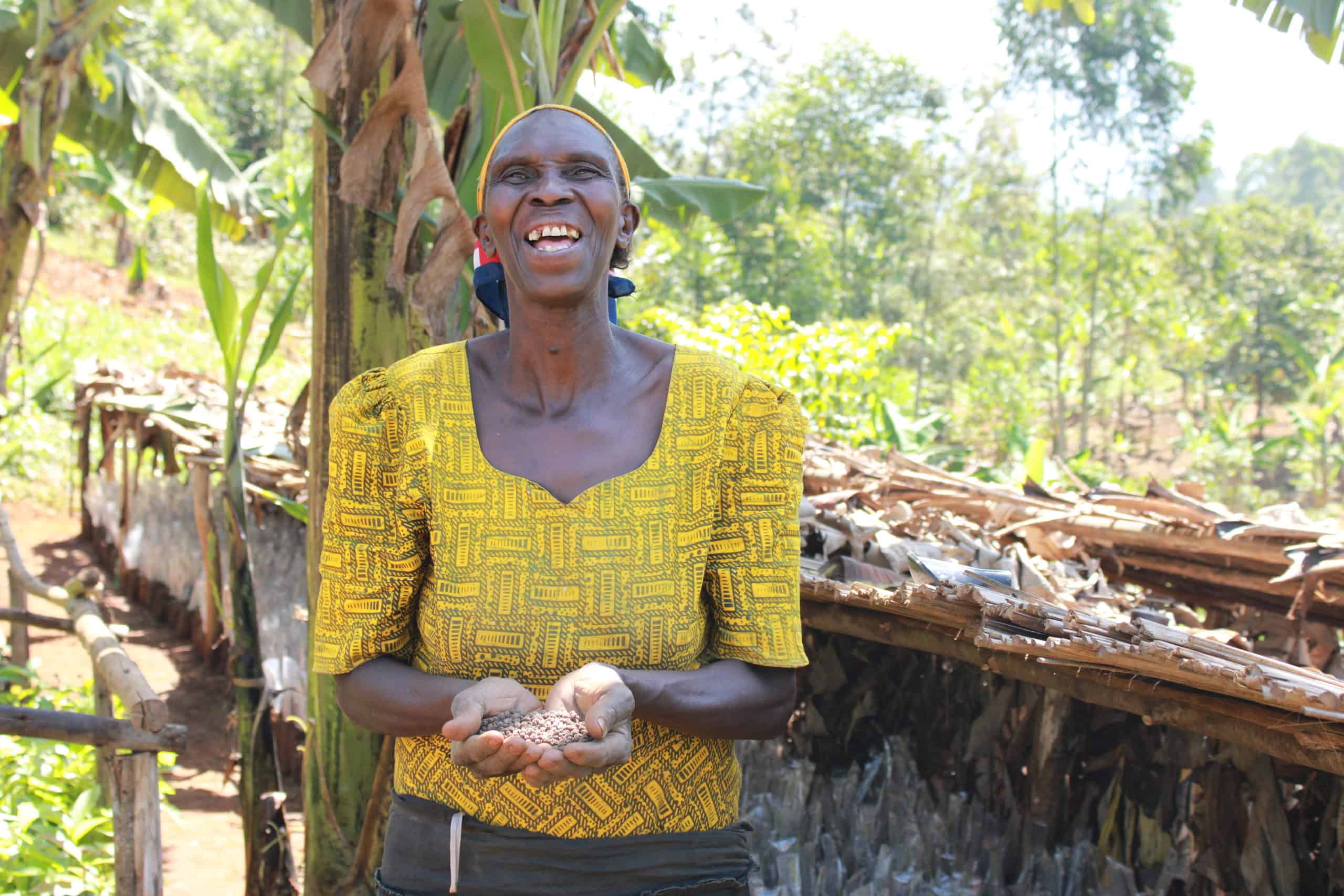 TREES Uganda farmer with seeds in her hands